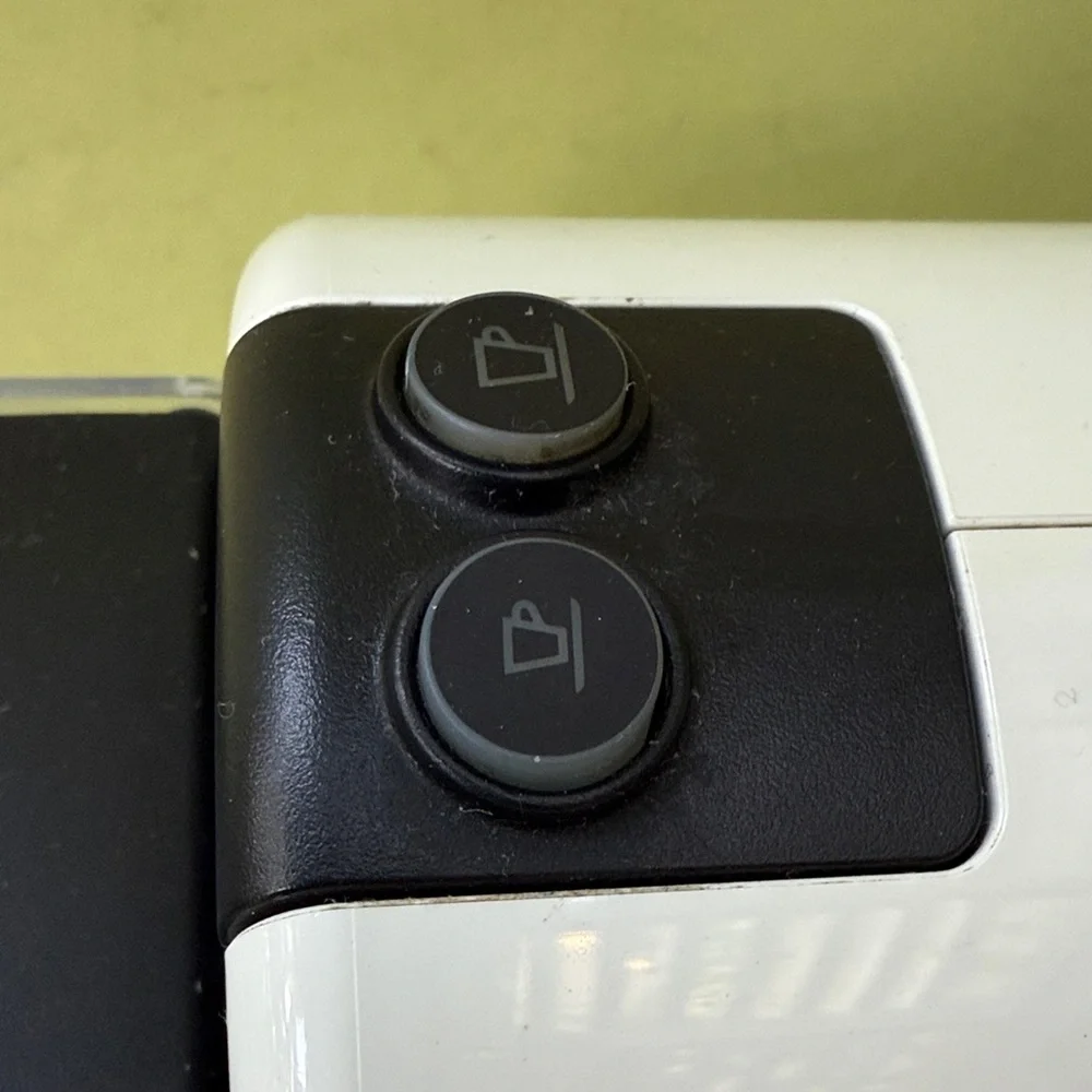 Nespresso White and Black Coffee Maker